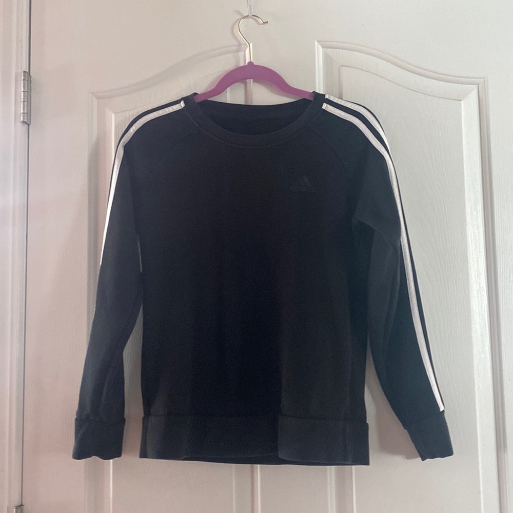 Woman’s Black Adidas athletic sweatshirt.